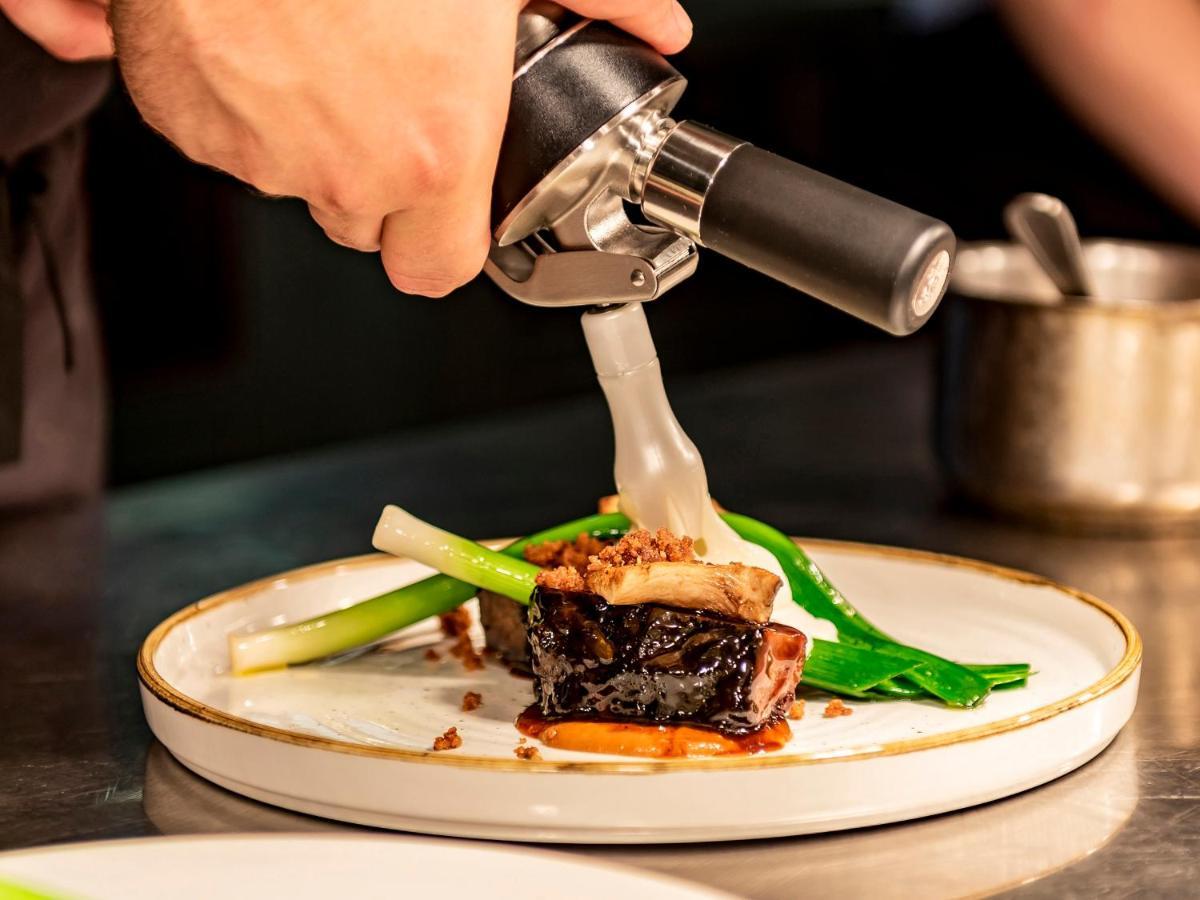 Dakota Leeds Hotel Leeds  Exterior photo A chef plating a dish